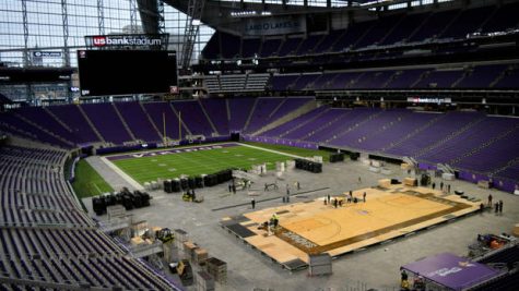 Workers install a basketball court at U.S. Bank Stadium on Tuesday, Nov. 27, 2018, where the Vikings venue will hold its first basketball games. The court has been borrowed from the Denny Sanford Premier Center in Sioux Falls, S.D. The Gophers are scheduled to play Oklahoma State there at 9 p.m. Friday night. (Courtesy of SMG / U.S. Bank Stadium)