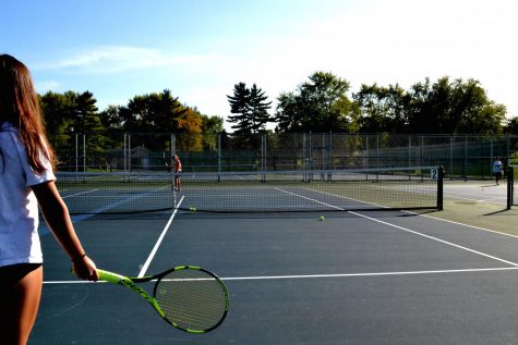  Lucy Lee (Front) and Natalie Yoho (Back) on the Tennis Court Preparing to play versus one another.