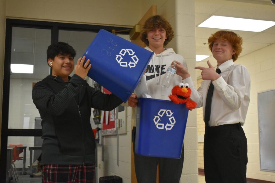 Sophomore Oswaldo Sanchez, freshman Ethan Hennef, and freshman Anthony Annarella are all recycling.