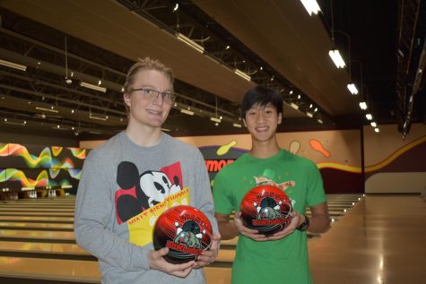 GCHS Varsity Boys Bowling Captain Josh Hawkins & Jake Siong posing with customized Grant High School bowling balls.