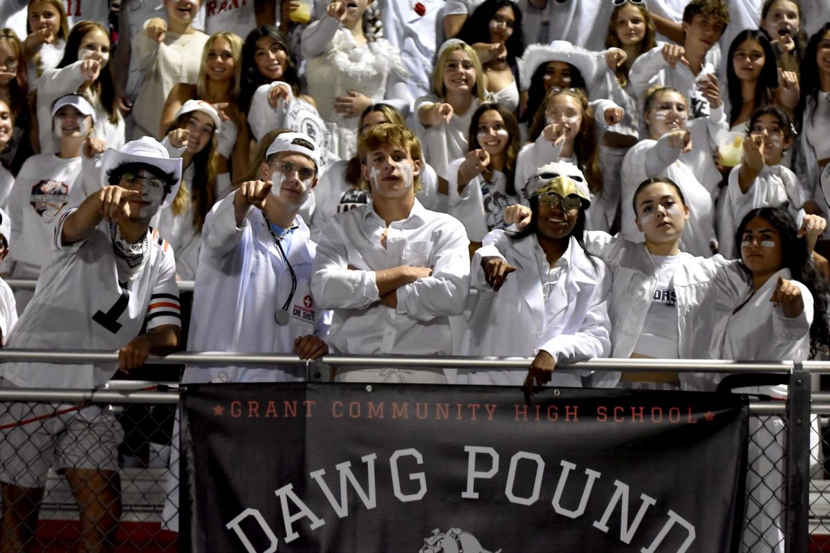 The 2023 Dog Pound leaders includes part
of the super fan section during a varsity
football game.