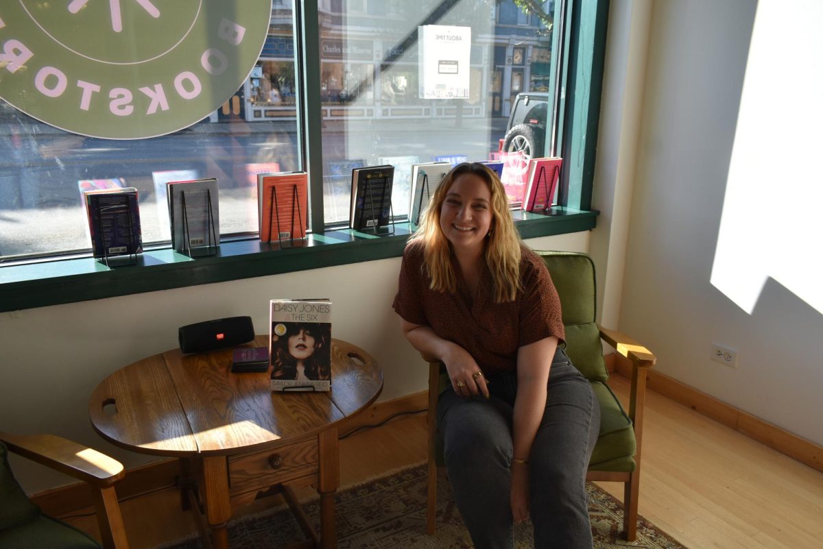 Dochelli sitting in her new bookstore in downtown Libertyville. 